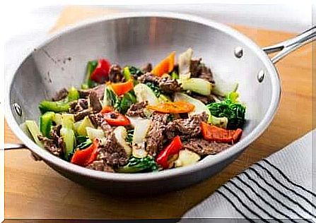 Cooking wok with vegetables and meat - bimbimbap