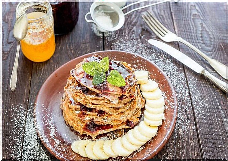 this breakfast is delicious: pancakes with bananas